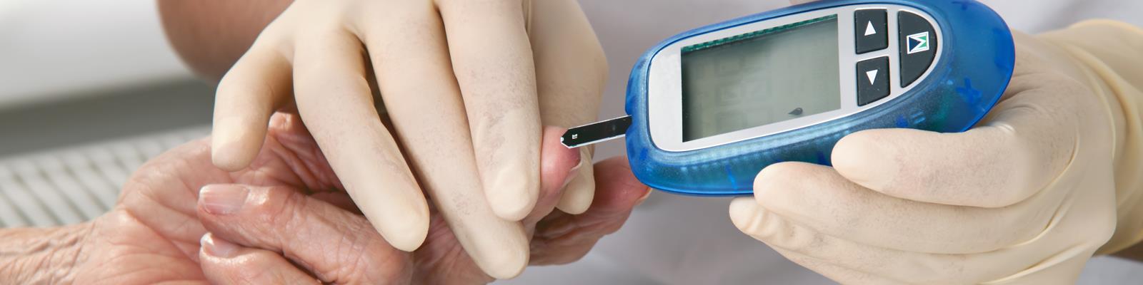 Close up of blood sugar level being checked for diabetes patient